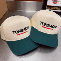 Beige and green baseball caps