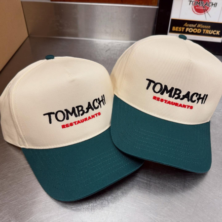 Beige and green baseball caps