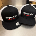 black and white Tombachi caps